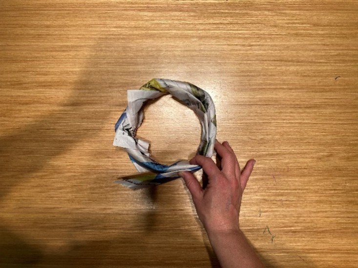 Paper formed into a ring showing even thickness around the circle.